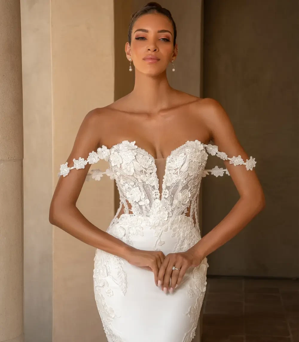 Model wearing a white Fit & Flare Gown