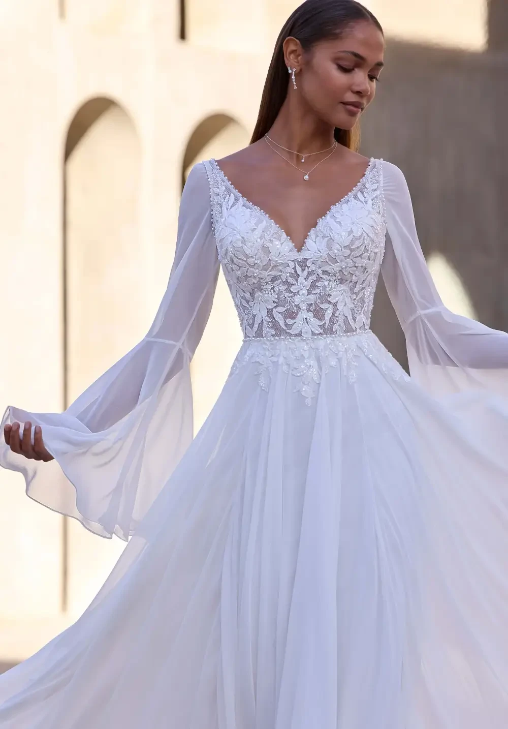 Model wearing a white Boho Gown
